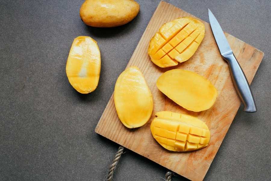 Mangoes on chopping board